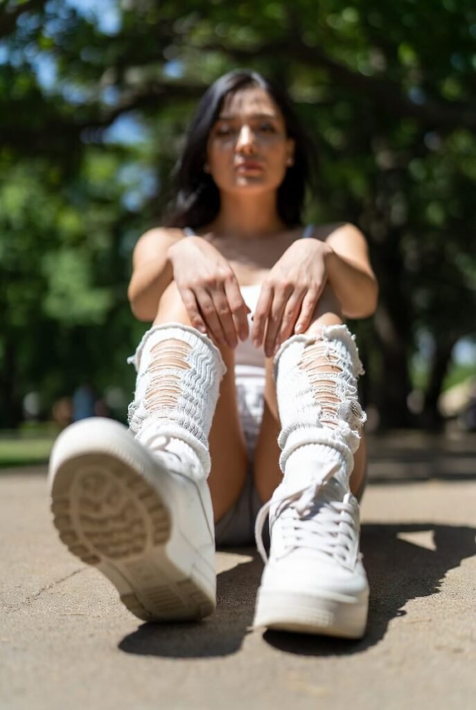 White sneakers with shocked-face meme socks
